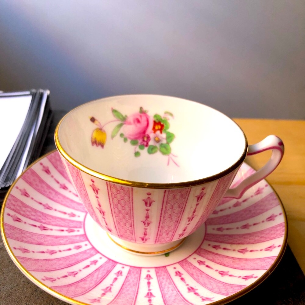 Vintage gold-rimmed china teacup and saucer